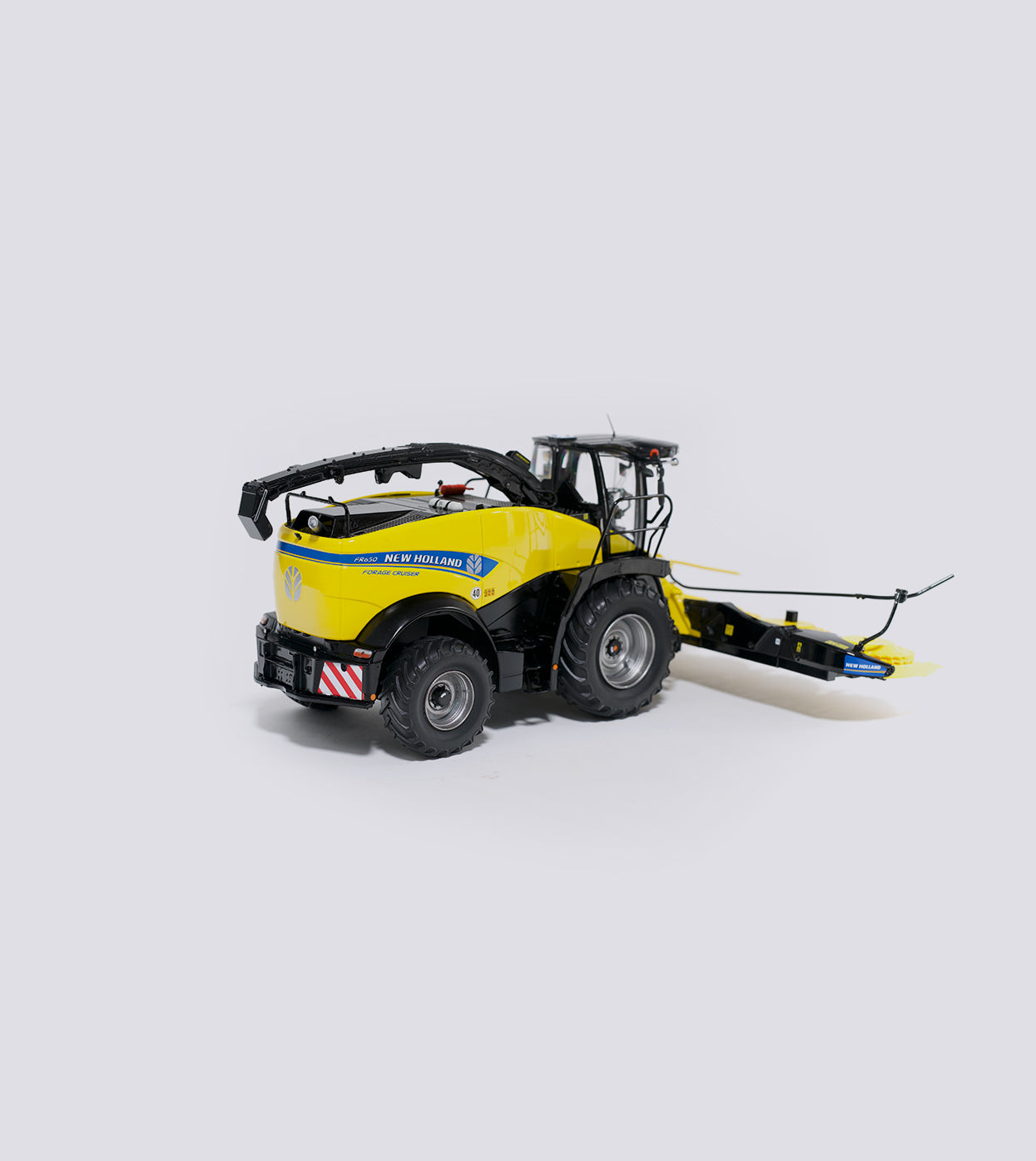 New Holland FR650 with silver-gray rims (1:32)